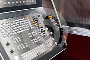 Modern CNC machining center with a control panel
