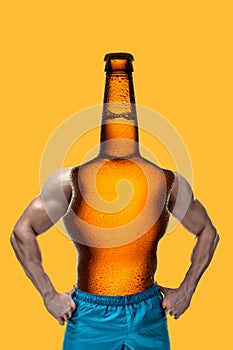 Modern collage. Concept man with bottle beer body and head, muscular arms on yellow background.