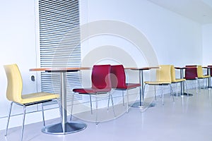 Modern colourful chairs and tables in a cafeteria