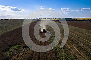 Modern combine harvester working on a wheat crop.