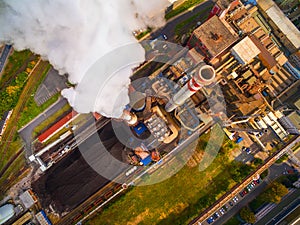 Modern combined heat and power plant with fuming chimney. photo