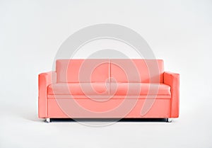 Modern comfortable pink sofa on white studio background