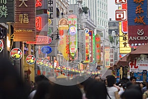 Modern commercial city street, urban shopping street with crowded people, street view of China