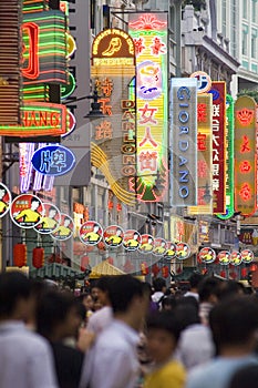 Modern commercial city street, urban shopping street with crowded people, street view of China