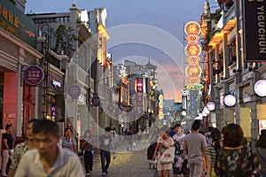 Modern commercial city street, urban shopping street with crowded people, street view of China