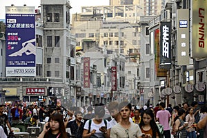 Modern commercial city street, urban shopping street with crowded people, street view of China