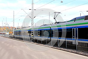 Modern Commuter Train Departs Station