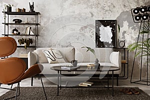 Modern compostion at living room interior with mock up poster frame, gray carpet, design gray sofa, brown leather armchair, oval