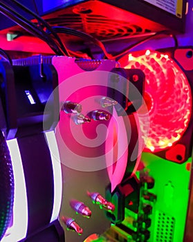 Modern computer air cooling with multi-colored led backlight-fans, cooling radiators, cables, boards, close-up, macro