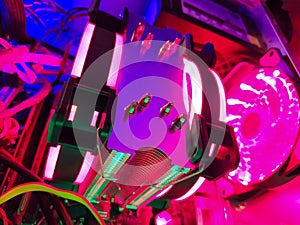 Modern computer air cooling with multi-colored led backlight-fans, cooling radiators, cables, boards, close-up, macro