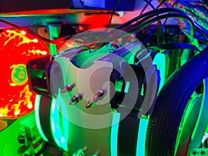 Modern computer air cooling with multi-colored led backlight-fans, cooling radiators, cables, boards, close-up, macro