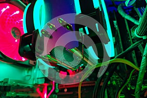 Modern computer air cooling with multi-colored led backlight-fans, cooling radiators, cables, boards, close-up, macro