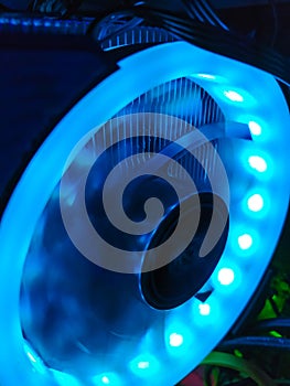 Modern computer air cooling with multi-colored led backlight-fans, cooling radiators, cables, boards, close-up, macro.