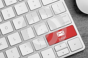 Modern computer keyboard with envelope sign on button, closeup. Sending email letters