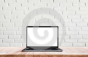 Modern computer,laptop with blank screen on white wall brick photo