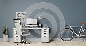 Modern computer monitor with the grey wall and bicycle