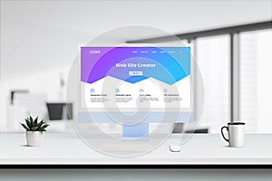 Modern computer screen on desk showcases purple-blue Web Site Creator interface