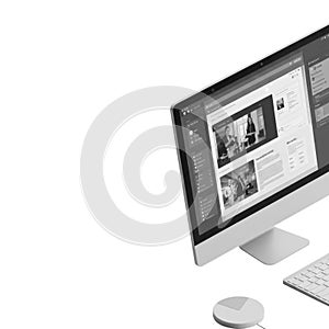 Modern computer setup with website display on screen and wireless peripherals