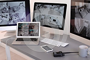 Modern computers with video broadcasting from security cameras at guard`s workplace
