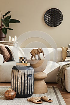 Modern concept of mediterranean interior with design sofa, wooden stool, coffee table, pillow, blanket, decoration, plant.