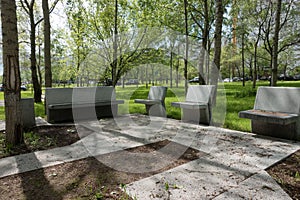 Modern concrete benches and path in a public park.