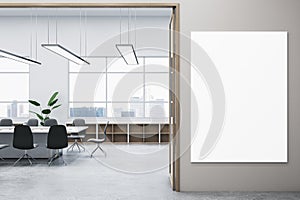 Modern concrete meeting room office interior with blank mock up banner on wall, window and city view, furniture and other items.