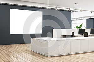 Modern concrete and wooden office lobby interior with empty white mock up frame on gray wall and various items.