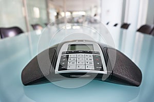 Modern conference room, focus on phone