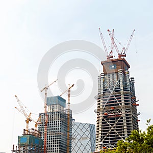 Modern construction. Crane building a new skyscraper.