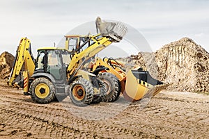 Modern construction machinery at a construction site in a quarry. Powerful modern equipment for earthworks. Rental of construction