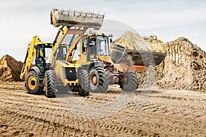 Modern construction machinery at a construction site in a quarry. Powerful modern equipment for earthworks. Rental of construction