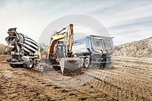 Modern construction machinery at a construction site in a quarry. Powerful modern equipment for earthworks. Rental of construction