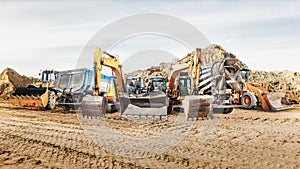 Modern construction machinery at a construction site in a quarry. Powerful modern equipment for earthworks. Rental of construction