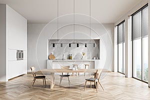 Modern contemporary design kitchen room interior. Dining table with chairs. panoramic windows. White and wood material