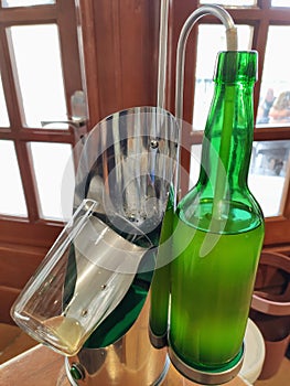 Modern contraption to serve cider in a restaurant, Luarca, Asturias, Spain