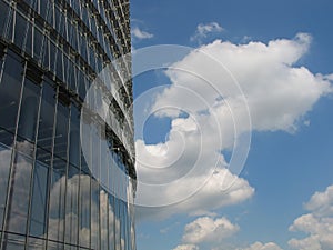 Modern corporate building with sky reflections