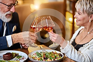 Modern couple have dinner and celebrate in restaurant