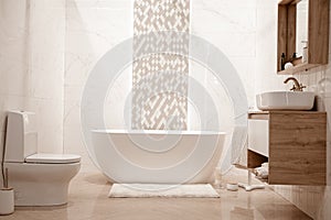 Modern and cozy bathroom interior with decorative elements