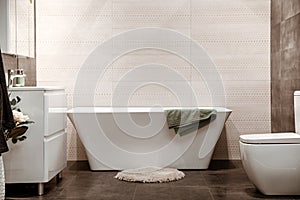 Modern and cozy bathroom interior with decorative elements