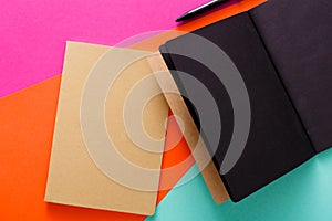 Modern creative work space with stylish black notepad