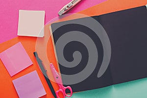 Modern creative work space with stylish black notepad