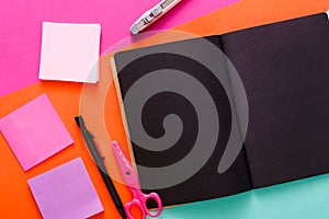 Modern creative work space with stylish black notepad