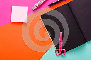Modern creative work space with stylish black notepad