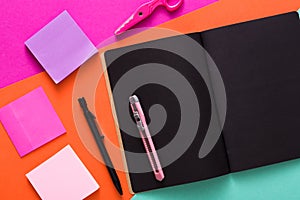Modern creative work space with stylish black notepad
