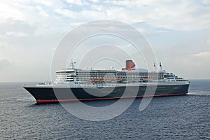 Modern cruise ship approaching port photo