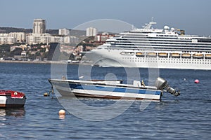 Modern cruise ship in front of lisbon portugal