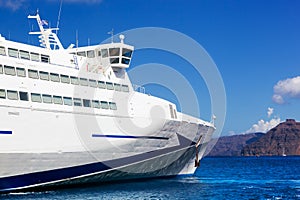 Modern cruise ship sailing on Aegean sea, Santorini Greece