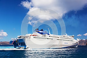 Modern cruise ship sailing on Aegean sea, Santorini Greece