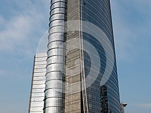 Modern Curved Skyscraper with Shiny Glass Facade