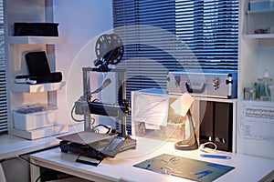 Modern 3d Printer Operating on Desk in Contemporary Engineering Workspace